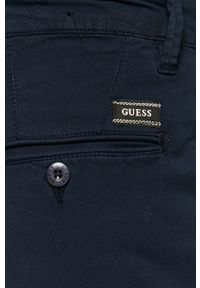 Guess - Spodnie. Kolor: niebieski. Materiał: tkanina, bawełna, materiał, elastan. Wzór: gładki #2
