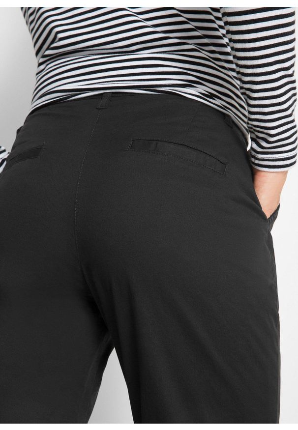 bonprix - Spodnie chino ocieplane. Kolor: czarny