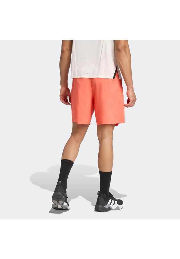 Adidas - Spodenki fitness męskie ADIDAS. Kolor: pomarańczowy. Sport: fitness
