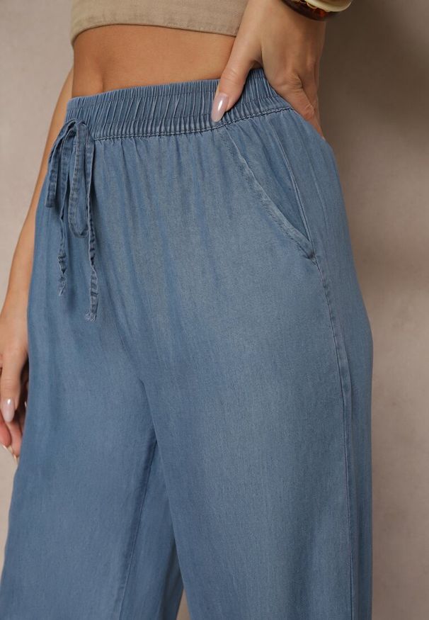Renee - Niebieskie Spodnie z Bawełną o Szerokim Kroju High Waist z Wiązaniem Noleldi. Okazja: na co dzień. Stan: podwyższony. Kolor: niebieski. Materiał: bawełna. Styl: elegancki, casual