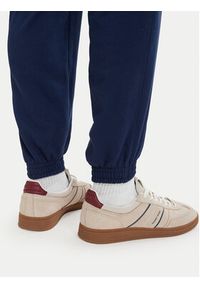 TOMMY HILFIGER - Tommy Hilfiger Spodnie dresowe Essential UM0UM03911 Granatowy Relaxed Fit. Kolor: niebieski. Materiał: bawełna #2