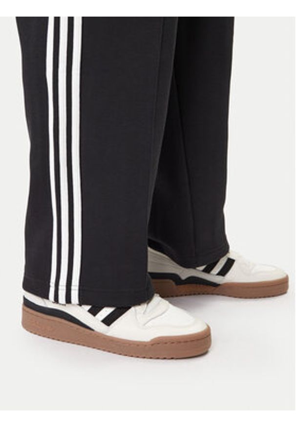 Adidas - adidas Spodnie dresowe adicolor Spacer Track JX1506 Czarny Baggy Fit. Kolor: czarny. Materiał: bawełna. Sport: turystyka piesza