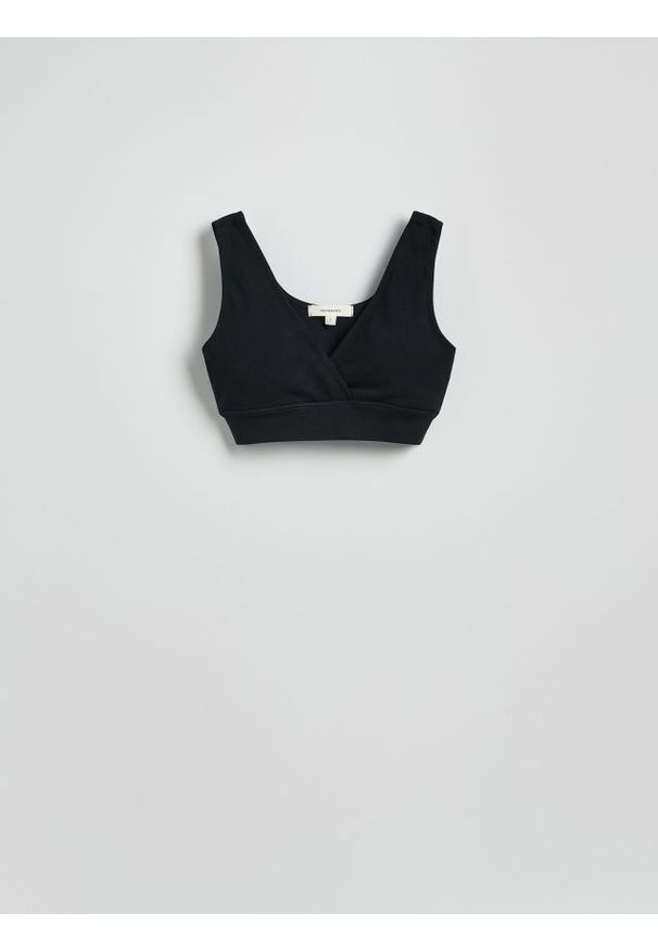 Reserved - Bezszwowy top w stylu sportowym - czarny. Kolor: czarny. Materiał: prążkowany, dzianina. Długość: krótkie. Styl: sportowy