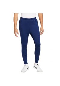 Nike - Męskie Spodnie Do Biegania ThermaFit Strike. Kolor: niebieski