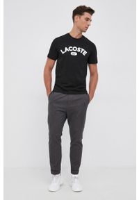 Lacoste T-shirt bawełniany kolor czarny z aplikacją. Okazja: na co dzień. Kolor: czarny. Materiał: bawełna. Wzór: aplikacja. Styl: casual