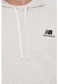 New Balance bluza UT21500SAH męska kolor szary z kapturem melanżowa. Typ kołnierza: kaptur. Kolor: szary. Materiał: materiał. Wzór: melanż