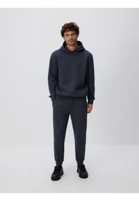 Reserved - Spodnie dresowe slim fit - ciemnoszary. Kolor: szary. Materiał: dresówka
