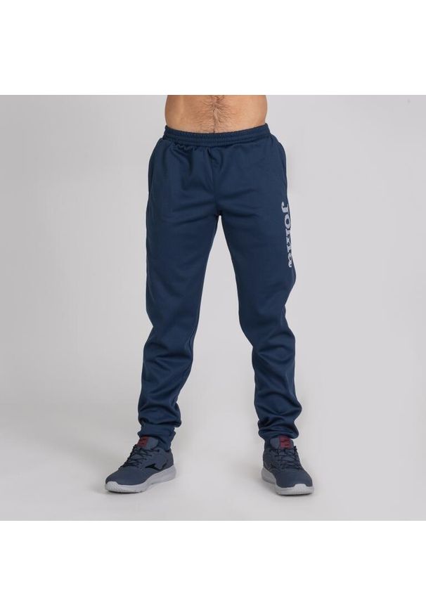 Spodnie do piłki nożnej dla chłopców Joma Suez. Kolor: niebieski. Materiał: poliester. Sport: piłka nożna