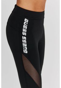 Guess - GUESS Czarne legginsy z logo i przeszyciami. Kolor: czarny. Materiał: poliester. Wzór: aplikacja #6