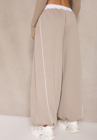 Renee - Beżowe Dresowe Spodnie z Wiskozą High Waist Ozdobione Lampasami Maiviona. Okazja: na co dzień. Stan: podwyższony. Kolor: beżowy. Materiał: dresówka, wiskoza. Wzór: aplikacja. Styl: sportowy, casual