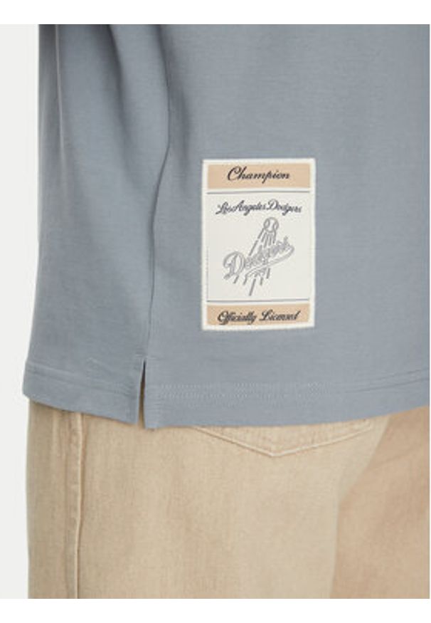 Champion Polo 221044 Niebieski Regular Fit. Typ kołnierza: polo. Kolor: niebieski. Materiał: bawełna