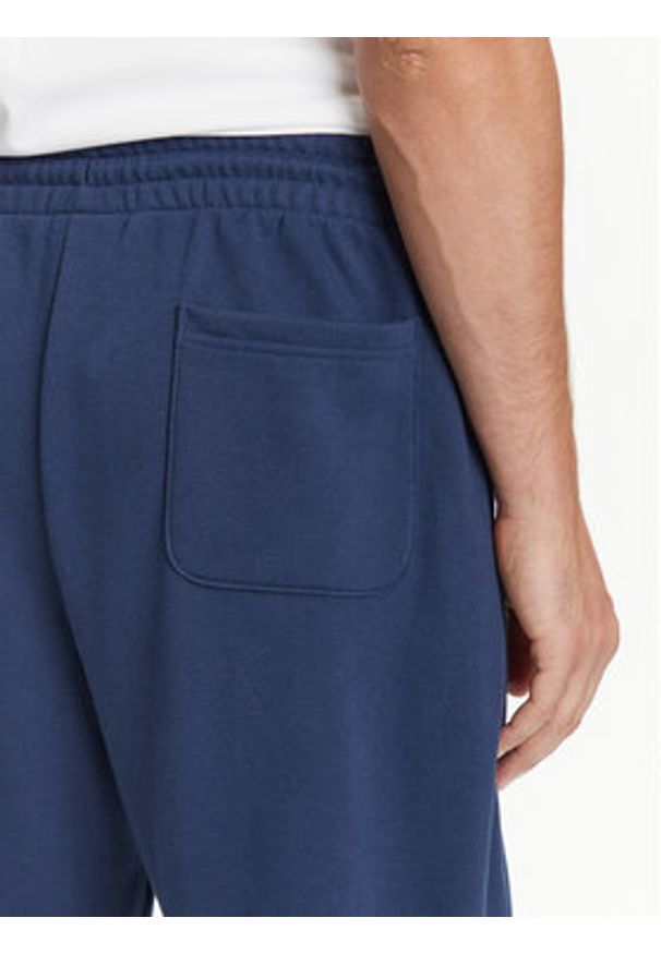 New Balance Spodnie dresowe Essentials MP41519 Granatowy Relaxed Fit. Kolor: niebieski. Materiał: bawełna, syntetyk