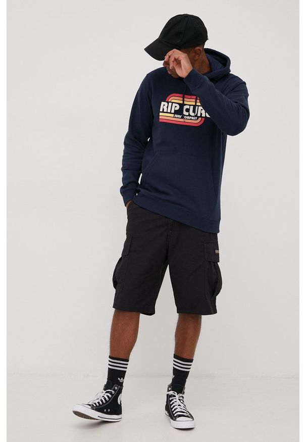 Rip Curl bluza męska kolor granatowy z kapturem z nadrukiem. Typ kołnierza: kaptur. Kolor: niebieski. Materiał: dzianina. Wzór: nadruk