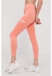 Reebok Legginsy damskie kolor pomarańczowy z nadrukiem. Stan: podwyższony. Kolor: pomarańczowy. Materiał: poliester. Wzór: nadruk #6