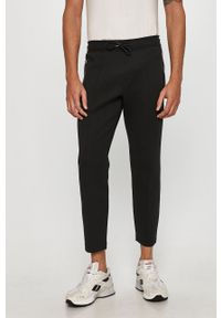 Calvin Klein - Spodnie. Kolor: czarny. Materiał: bawełna, poliester, dzianina, elastan. Wzór: gładki #1