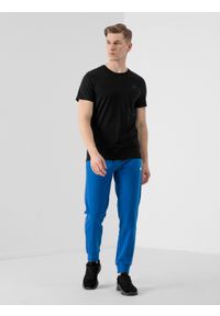 4f - Spodnie dresowe joggery męskie. Kolor: niebieski. Materiał: dresówka #1