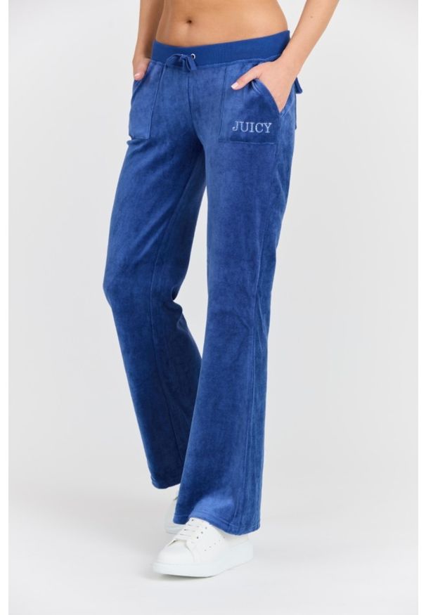Juicy Couture - JUICY COUTURE Damskie niebieskie spodnie Heritage Crown Caisa Low Rise Pant. Kolor: niebieski. Materiał: poliamid, materiał, bawełna. Długość: długie