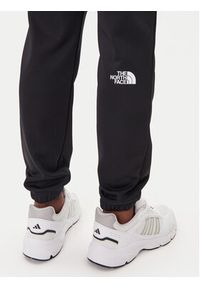 The North Face Spodnie dresowe Reaxion 2.0 NF0A8DRS Czarny Regular Fit. Kolor: czarny. Materiał: syntetyk #5