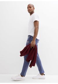 bonprix - Spodnie sportowe z czystej bawełny, ze sportowymi detalami. Kolor: niebieski. Materiał: bawełna. Wzór: nadruk. Styl: sportowy #2