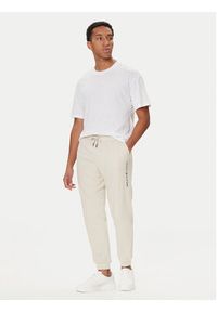 TOMMY HILFIGER - Tommy Hilfiger Spodnie dresowe UM0UM03664 Écru Regular Fit. Materiał: bawełna #4