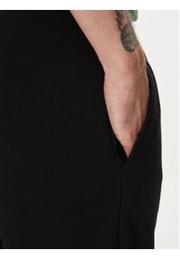 Lacoste Spodnie dresowe XH9624 Czarny Regular Fit. Kolor: czarny. Materiał: bawełna