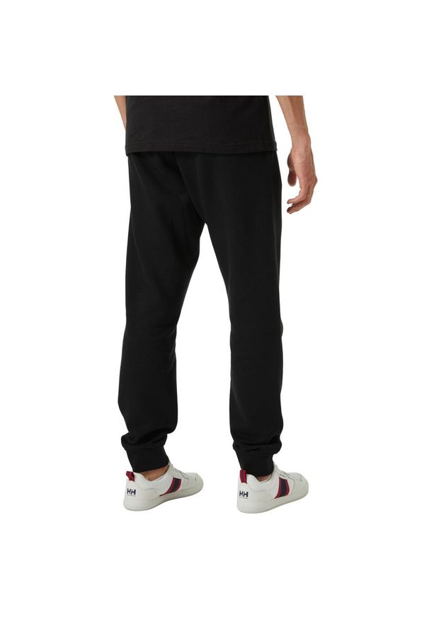 Spodnie sportowe męskie Helly Hansen Core. Kolor: czarny. Materiał: dresówka
