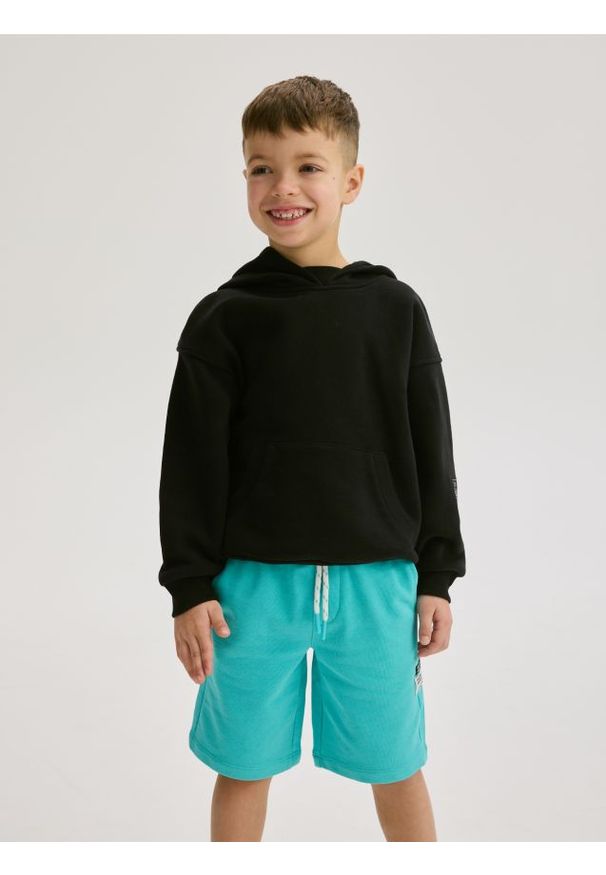 Reserved - Bawełniane szorty - miętowy. Kolor: miętowy. Materiał: bawełna. Wzór: gładki