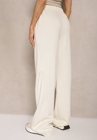 Renee - Jasnobeżowe Spodnie o Szerokim Kroju High Waist z Gumką w Pasie Belobira. Okazja: na co dzień. Stan: podwyższony. Kolor: beżowy. Długość: długie. Styl: casual, elegancki, wizytowy