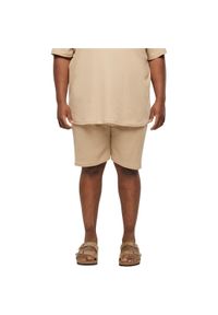 Szorty Urban Classics Waffle. Kolor: beżowy. Materiał: materiał. Długość: krótkie. Sezon: lato #1