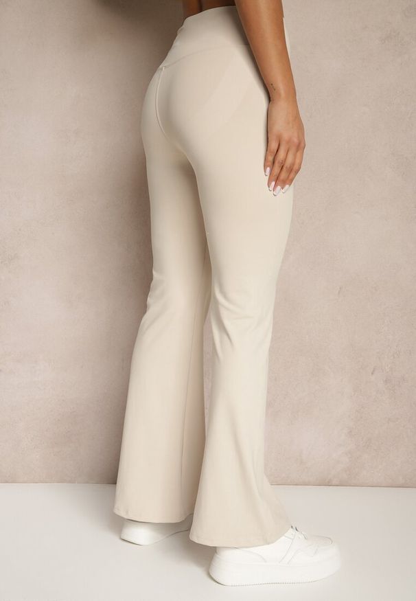 Renee - Beżowe Spodnie Dzwony Legginsy High Waist Onellin. Okazja: na uczelnię, na co dzień. Stan: podwyższony. Kolor: beżowy. Styl: retro, elegancki, casual