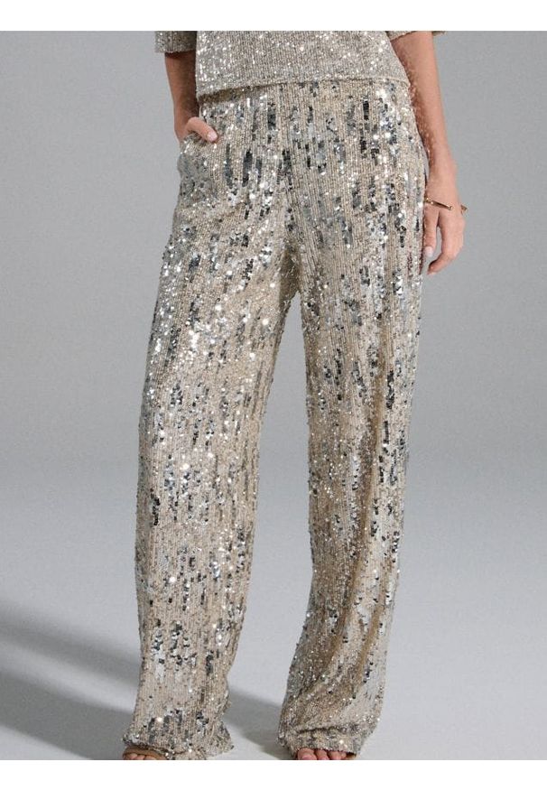 Sinsay - Cekinowe spodnie wide leg - srebrny. Kolor: srebrny
