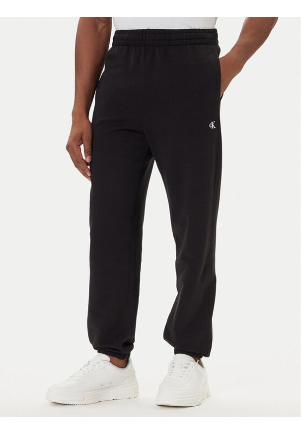 Calvin Klein Jeans Spodnie dresowe LV04RD241G Czarny Regular Fit. Kolor: czarny. Materiał: bawełna