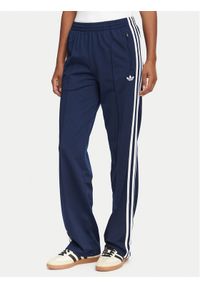 Adidas - adidas Spodnie dresowe Firebird Classic KS4795 Granatowy Regular Fit. Kolor: niebieski. Materiał: syntetyk #1