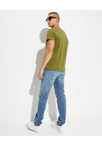 Balmain - BALMAIN - Niebieskie jeansy z haftowanym logo. Kolor: niebieski. Długość: długie. Wzór: haft. Styl: klasyczny #4