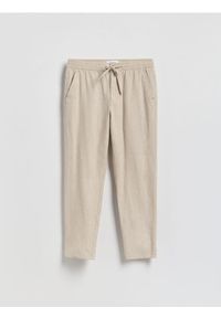 Reserved - Spodnie carrot z lnem - beżowy. Kolor: beżowy. Materiał: len #1