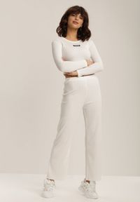 Renee - Białe Spodnie Szerokie Salanome. Stan: podwyższony. Kolor: biały. Materiał: guma, dzianina. Wzór: ażurowy, prążki #4