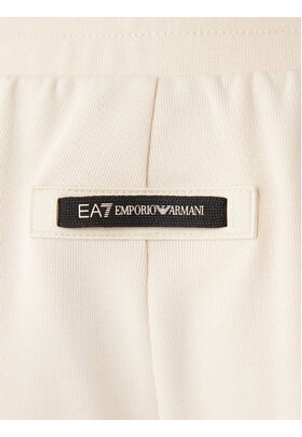 EA7 Emporio Armani Spodnie dresowe 7M001482 AF12660 U1088 Beżowy Regular Fit. Kolor: beżowy. Materiał: bawełna, syntetyk
