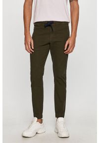 Tommy Jeans - Spodnie. Kolor: oliwkowy. Materiał: tkanina, bawełna, elastan. Wzór: gładki #1