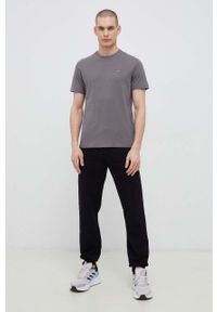 Fila spodnie dresowe kolor czarny gładkie. Kolor: czarny. Materiał: dresówka. Wzór: gładki #3