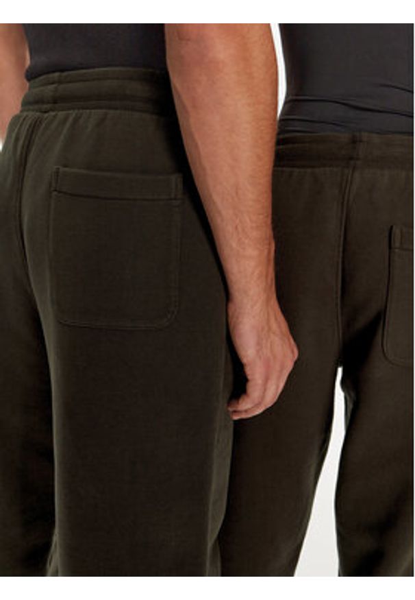 AMI PARIS - AMI Paris Spodnie dresowe UTR240.JE0091 Brązowy Regular Fit. Kolor: brązowy. Materiał: bawełna