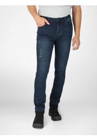 Volcano - Granatowe spodnie jeansowe męskie dopasowany krój D-DEXTER 22. Kolor: niebieski. Wzór: aplikacja. Styl: klasyczny