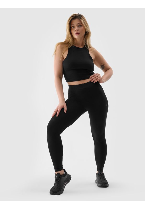 4f - Legginsy dzianinowe damskie - czarne. Okazja: na co dzień. Stan: obniżony. Kolor: czarny. Materiał: dzianina. Długość: do kostek. Wzór: ze splotem, gładki, jednolity. Styl: casual, sportowy