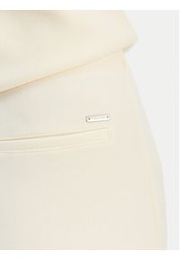 Calvin Klein Spodnie materiałowe LV044B223G Beżowy Flare Fit. Kolor: beżowy. Materiał: syntetyk #4