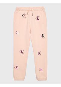 Calvin Klein Jeans Spodnie dresowe Monogram IG0IG01906 Różowy Regular Fit. Kolor: różowy. Materiał: bawełna