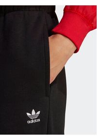 Adidas - adidas Spodnie dresowe Essentials Fleece IA6437 Czarny Regular Fit. Kolor: czarny. Materiał: bawełna