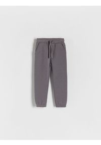 Reserved - Dresowe spodnie jogger - ciemnoszary. Kolor: szary. Materiał: dresówka. Wzór: melanż