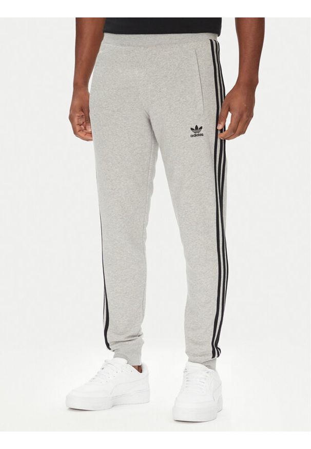 Adidas - adidas Spodnie dresowe adicolor 3-Stripes JY1387 Szary Slim Fit. Kolor: szary. Materiał: bawełna