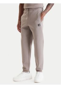 Hugo - HUGO Spodnie dresowe Dimacs 50533695 Beżowy Relaxed Fit. Kolor: beżowy. Materiał: bawełna #1