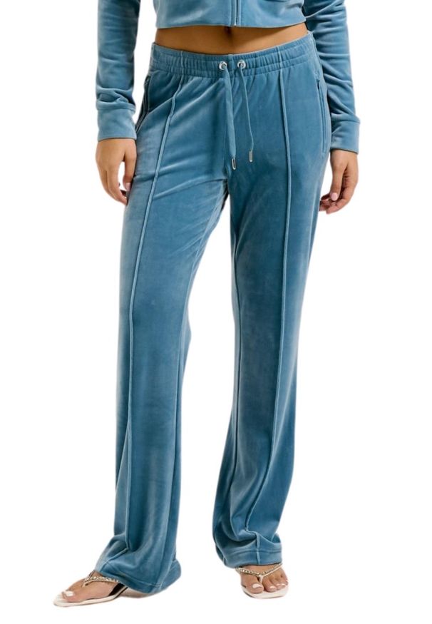 Juicy Couture - JUICY COUTURE Niebieskie damskie spodnie dresowe Tina Trackpants. Kolor: niebieski. Materiał: dresówka