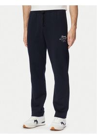 TOMMY HILFIGER - Tommy Hilfiger Spodnie dresowe Script Stack MW0MW44332 Granatowy Regular Fit. Kolor: niebieski. Materiał: bawełna #1